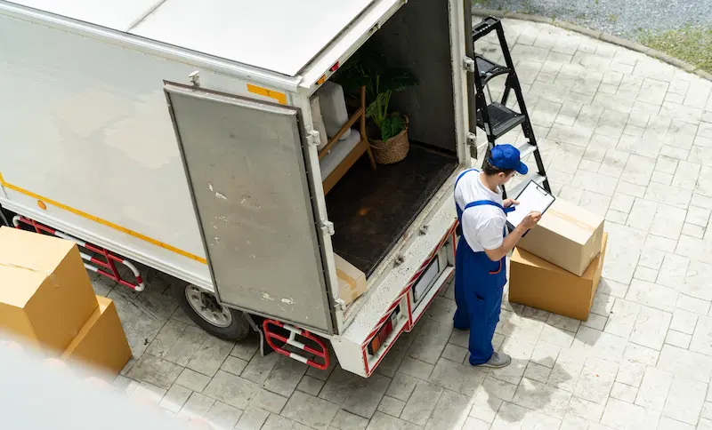 Movers unloading boxes after a move
